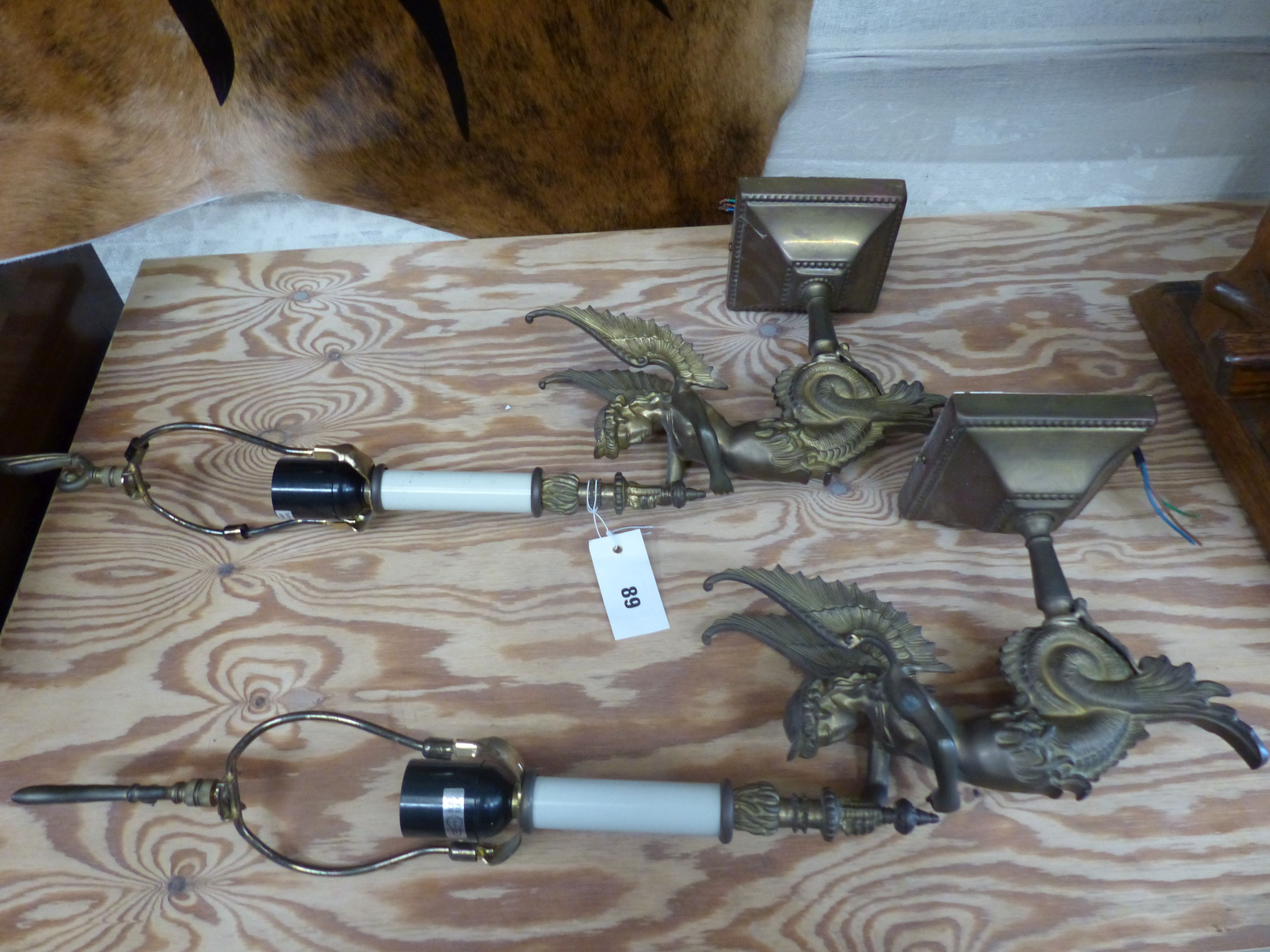 A pair of Empire style gilt metal wall lights, height 64cm